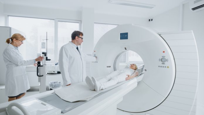 In,Medical,Laboratory,Female,Radiologist,And,Male,Doctor,Control,And