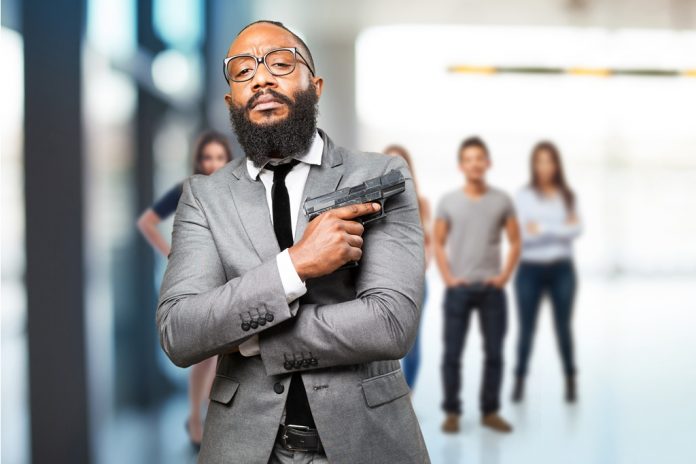 business black man holding a gun