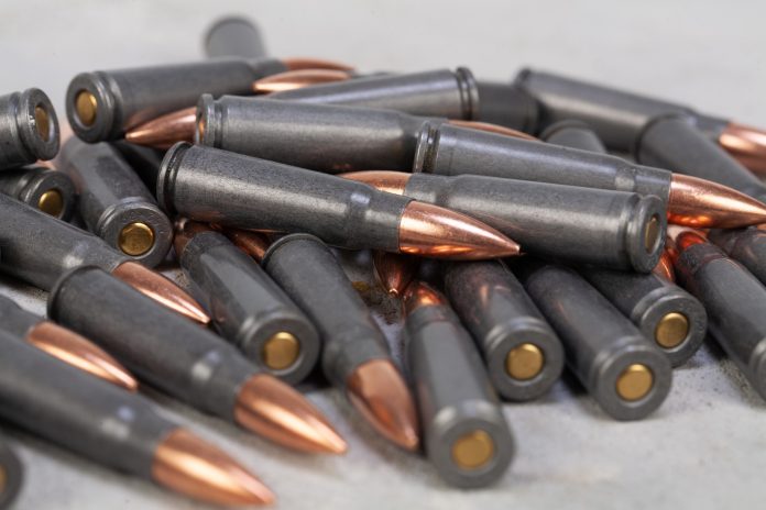 Kalashnikov,Ak,Gun,7,62,Mm,Bullets,On,Grey,Concrete,Surface