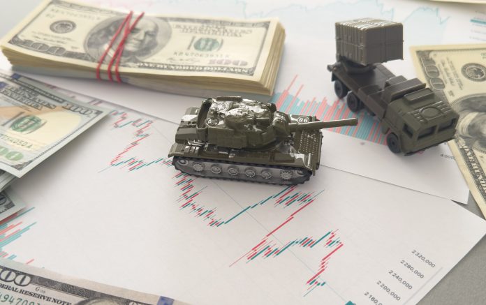 Small,Green,Tank,On,Many,Banknotes,.,Background,Of,War
